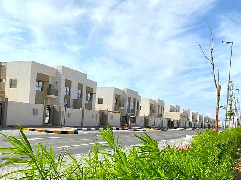 Row of villas along a community street, Sharjah Garden City