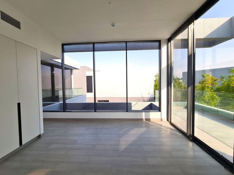 Bedroom with full-height glazing and balcony