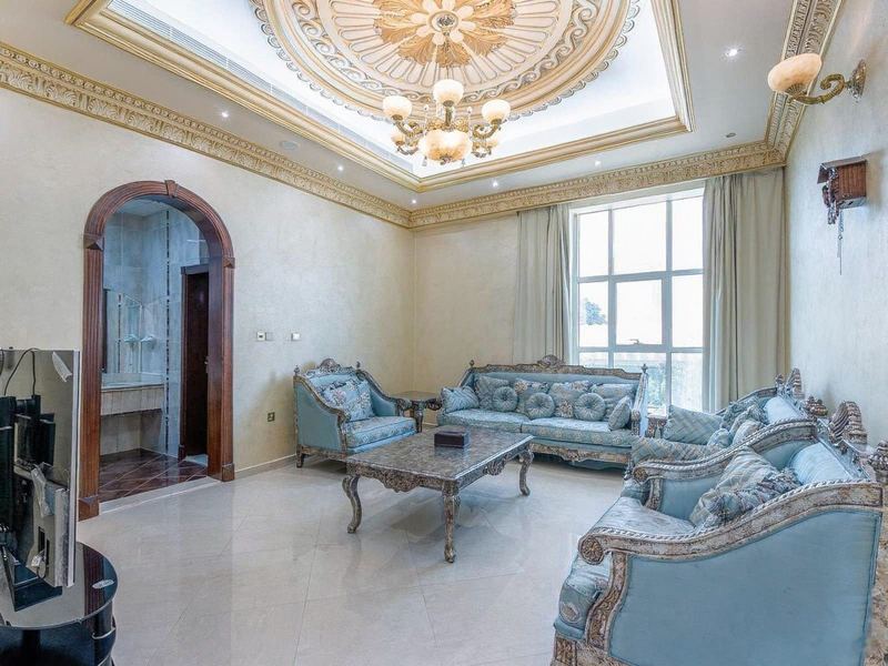 Formal majlis with ornate ceiling